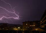 Fototapeta Tęcza - Lightning Storm in the town with city lights