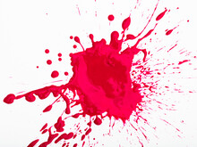 Closeup Of Shapeless Bright Red Ink Blot On White Background..
