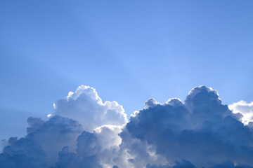 Wall Mural - Blue sky with cumulus clouds and sunlight before sunset, Nature background