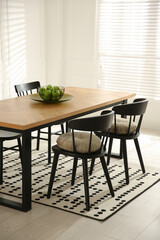 Poster - Stylish wooden dining table and chairs in room. Interior design