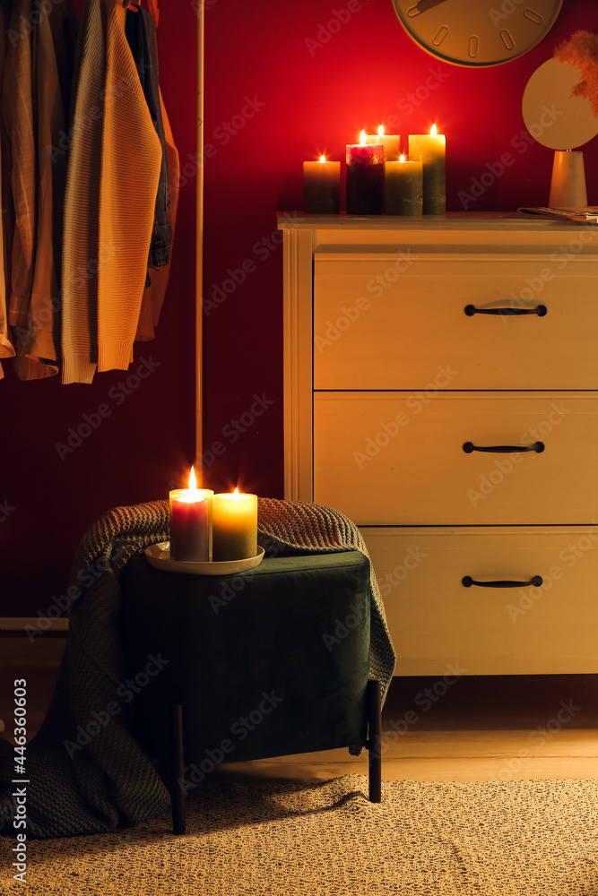 Interior of stylish dark room with burning candles