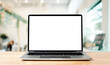© Monster Ztudio - Laptop blank screen on wood table with blurred coffee shop cafe interior background and lighting bokeh, mockup, template for your text, Clipping paths included for background and device screen