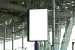 Blank screen advertise mockup in the airport terminal. Display for billboard ad in the building. Poster media template.