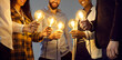 © Studio Romantic - Conceptual banner: happy young multiethnic people holding shining electric light bulbs. Team of coworkers join Edison lightbulbs as metaphor for teamwork and using creative ideas in business community