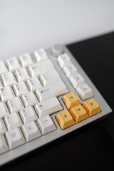 Poster - Closeup of white and yellow buttons on a mechanical computer keyboard