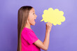 Profile side photo of happy amazed young small girl say tell news announce cloud isolated on violet color background