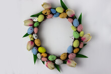 Easter Wreath Of Decorative Quail Eggs And Tulips. Top View Of The Rattan Wreath. Easter Decor