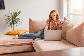 Poster - Cheerful woman using silver laptop