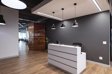 Interior of empty lobby with reception counter in modern office