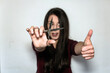 © AliciaFdez - Beautiful brunette woman with long hair showing the scissors to the camera doing the ok sign.