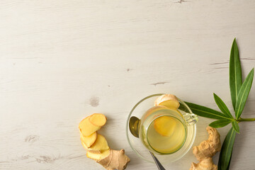 Sticker - Ginger drink; on white table with root and leaves top