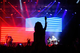 Fototapeta Tęcza - people dancing in a concert