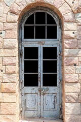 Wall Mural - Old vintage blue wood door ,Building entrance and brown stone wall