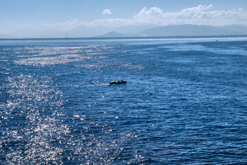 Fishermen in a Wooden Dinghy off the coast of Cap-Haitien, Haiti