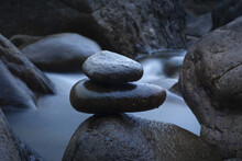 Closeup Shot Of Rocks On A Blurred River Background