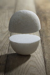 Sticker - Vertical shot of white stones on a wooden surface