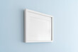 © Jon Ortiz - Interior house decoration, empty white frame, poster blank canvas, pictures mock up on a blue wall, living room, template angle view