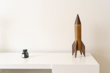 Interior kids bedroom design, wooden rocket, vintage skyrocket toy, residence nursery decor, old plaything, whit letter ink