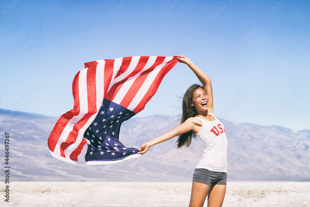 USA flag happy American Asian sports athlete woman waving after game winning cheering at outdoor landscape summer nature. - obrazy, fototapety, plakaty 