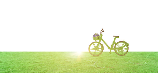 green ecological bicycle and globe on green grass field isolated on white background. environmentall