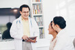 © themorningglory - Smiling young doctor with female patient at consultation