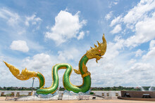 Full Body Naga Statue, With Beuatiful Sky Background At The Mekong River, Wat Lamduan Temple, Nong Khai Province Thailand. Most Famous Landmark. Left Side