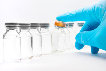 a bottle of vaccine on a white background