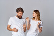 © SHOTPRIME STUDIO - cheerful man and woman in headphones music friendship together light background