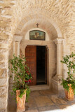 Fototapeta Uliczki - Entrance  from the courtyard to the small monastery of St. George on the border of the Jewish and Armenian quarters in the old city of Jerusalem, Israel