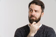 © Drobot Dean - White puzzled man with beard posing and looking aside