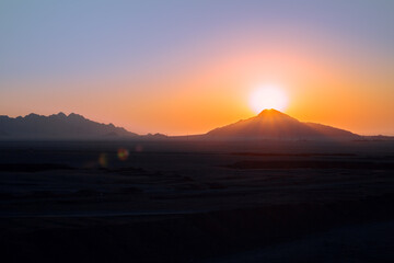 Wall Mural - Beautiful sunrise in the desert in the mountains