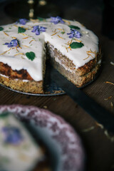 Poster - Tasty biscuit cake covered with white glaze and decorated with blue flowers