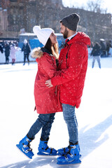 Sticker - Lovely couple spending time together at outdoor ice skating rink