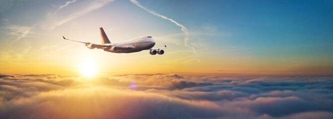 Passengers commercial airplane flying above clouds