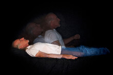 A Unique Multi Flash Image Of Man Lying Down And Rising Representing The Soul Leaving The Body Or Astral Travel.