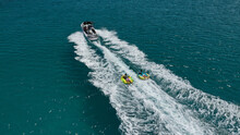 Aerial Photo Of Extreme Power Boat Donut Water-sports Cruising In High Speed In Tropical Emerald Bay