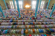 © AmazingAerialAgency - View of several people praying and worshipping in one of the biggest islamic mosque in the world, Dhaka, Bangladesh.