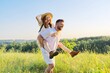 © Valerii Honcharuk - Happy laughing adult couple having fun outdoors, nature sky background