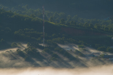 Wall Mural - the small village brighten in the foot mountains at dawn