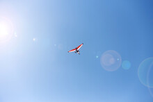 White-red Hang Glider And Sun Glare.