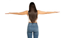 Rear View Of A Young Beautiful Woman With Outstretched Arms