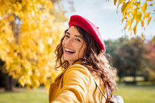Smiling Happy Woman Looking Behind In An Autumn Day