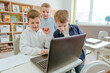 © lithiumphoto - Elementary school students learning in the classroom using laptop