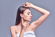 © Olena Apetroaiei - Armpit epilation, lacer hair removal. Young woman holding her arms up and showing clean underarms, epilation on smooth clear skin .Beauty portrait. Skin care.