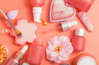 Cosmetic products. Pink bottles and tubes with dispensers, pipette, heart-shaped blush, brushes, cream, essence