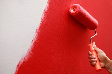 Wall Mural - Painter is painting the interior wall red