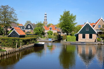 The historical town of Hindeloopen, Friesland, Netherlands, with historical houses, canals and the church