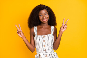 Poster - Photo of nice optimistic brunette lady show v-sign wear white top isolated on vivid yellow color background