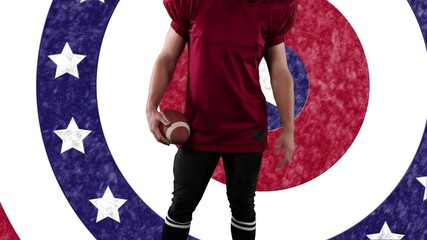 Poster - Mid section of male rugby player holding a ball against stars on spinning circles