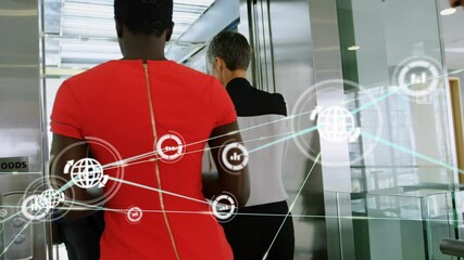 Canvas Print - Network of profile icons against diverse businesspeople entering the lift at office